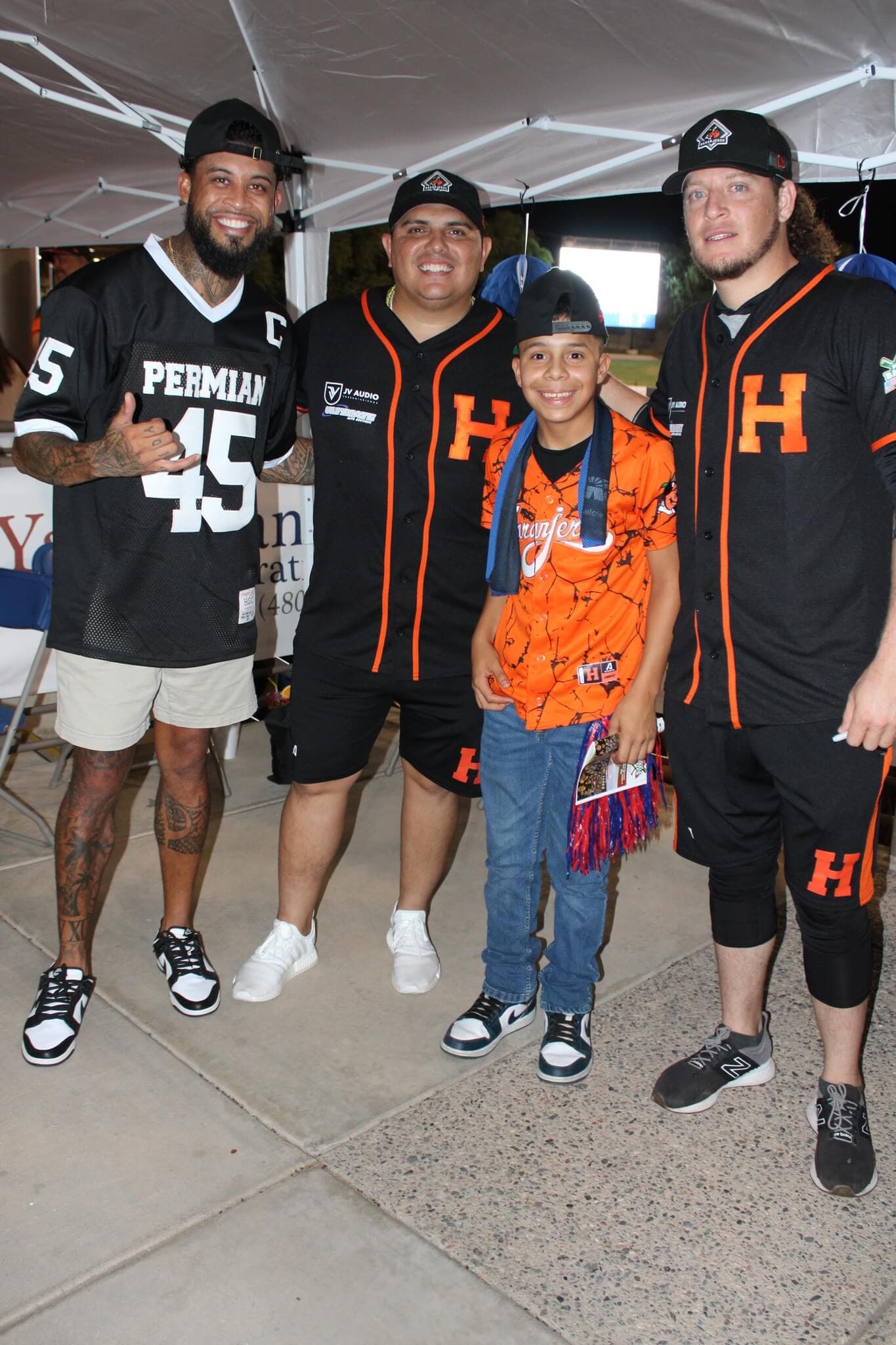 Players signing autographs for fans